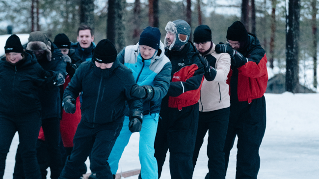 Arcady team in de sneeuw tijdens 10-jarig jubileum in Lapland